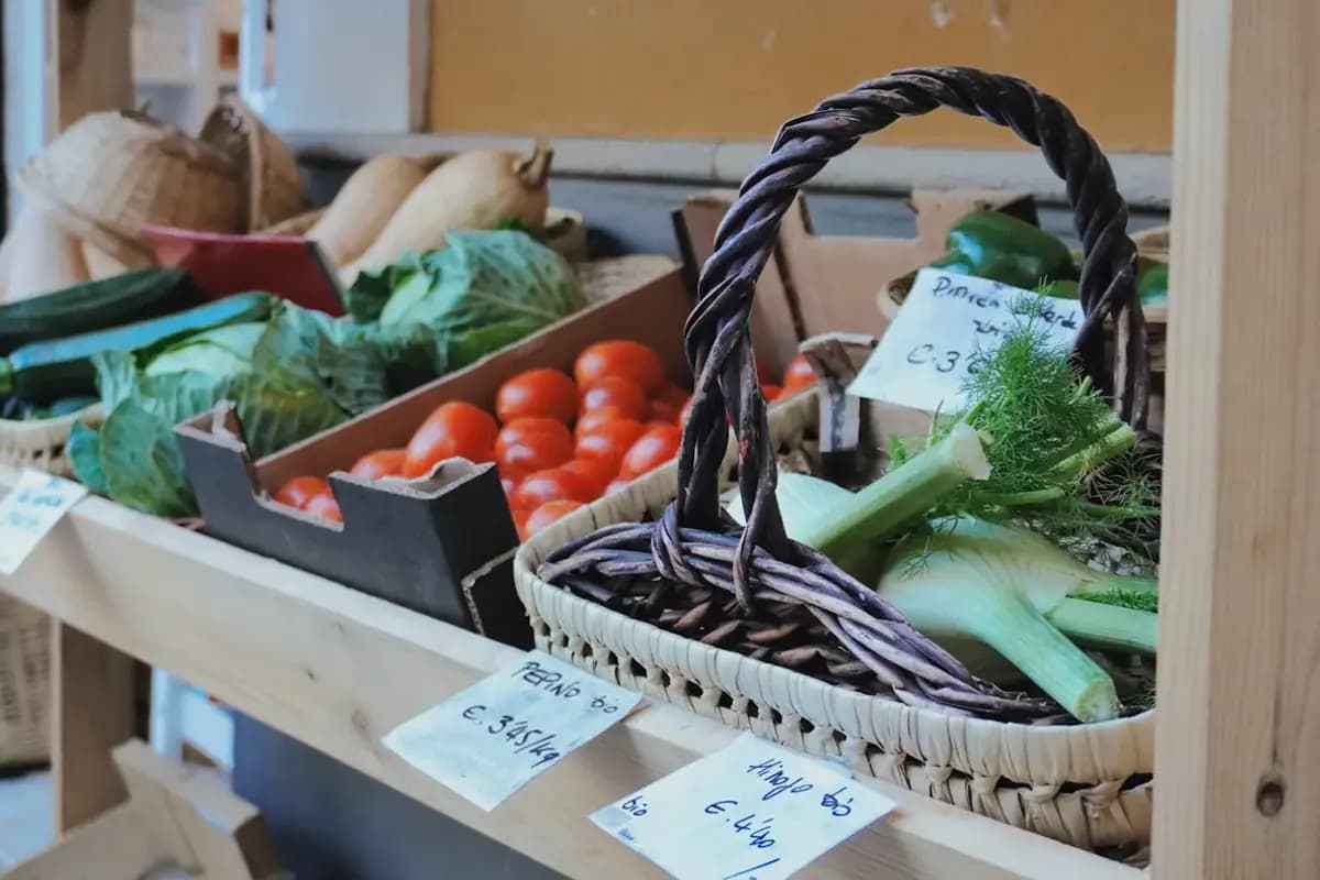 Fresh vegetables arranged in baskets at a produce market